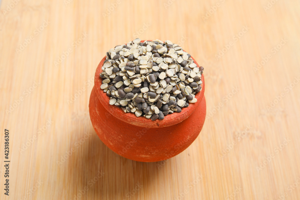 Split Black Lentil Also Know as Black Gram, Black Urad Dal, Vigna Mungo, Urad Bean on wooden background. Split Black Lentil Also Know as Black Gram, Black Urad Dal, Vigna Mungo, Urad Bean on wooden background.