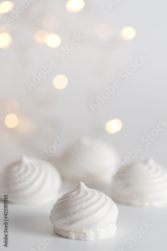 White meringue background with backlights. Front view. Macro photography