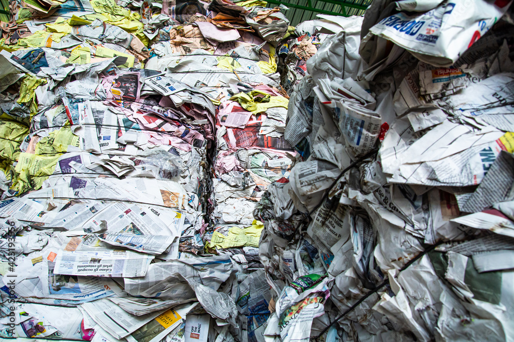 Catania, Italy, March 26 2021, Bottom view of piles of newspapers collected and ready to be recycled at landfill, recycling facilities, garbage, waste