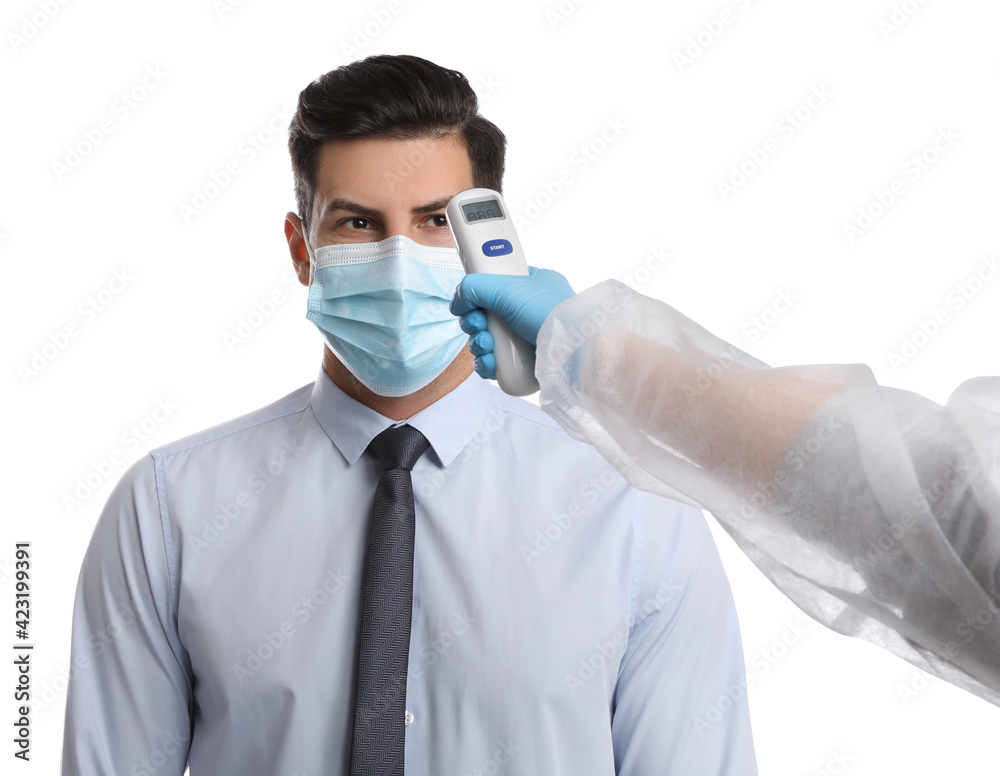 Doctor measuring man's temperature on white background, closeup. Prevent spreading of Covid-19