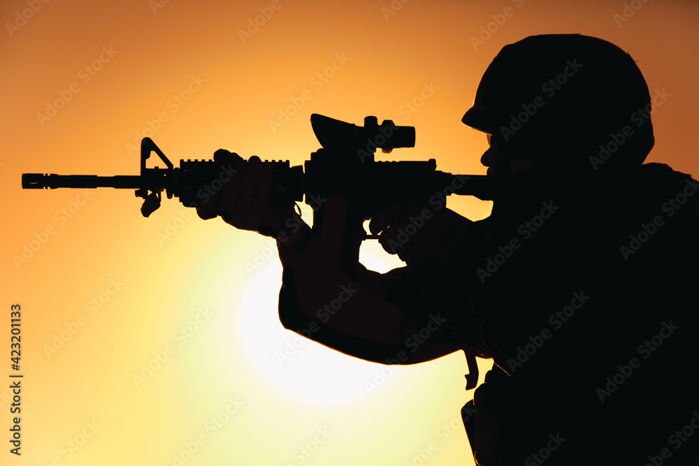 Silhouette of modern army infantry soldier standing on background of ...