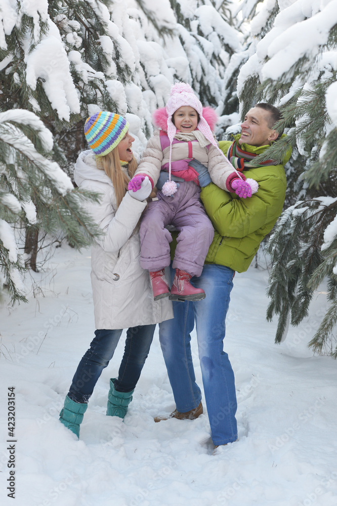 happy  family at beautiful sunny winter day outdoor in nature