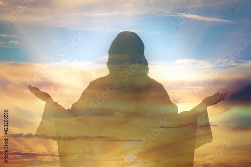 Fotografie, Obraz Silhouette of Jesus Christ and cloudy sky, double exposure