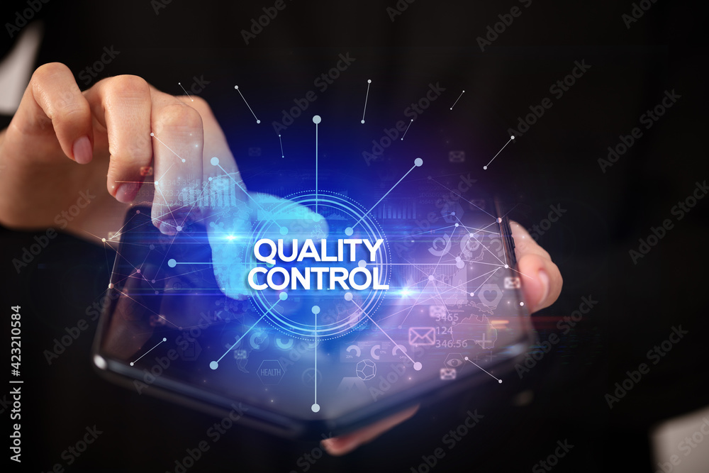 Businessman holding a foldable smartphone, new business concept Businessman holding a foldable smartphone, new business concept