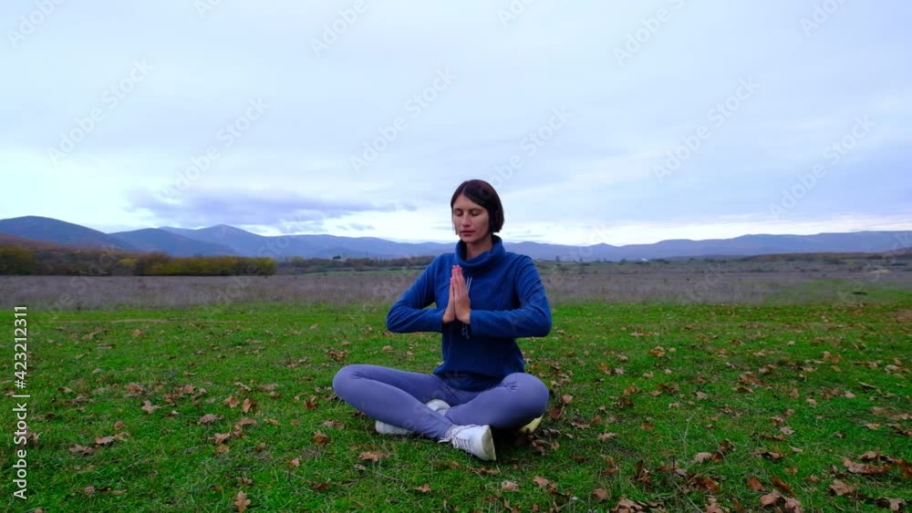 Woman enjoy yoga at autumn park near alone oak. zen yoga meditation practice in nature. idea and concept fitness, healthy lifestyle, Woman enjoy yoga at autumn park near alone oak. zen yoga meditation practice in nature. idea and concept fitness, healthy lifestyle,