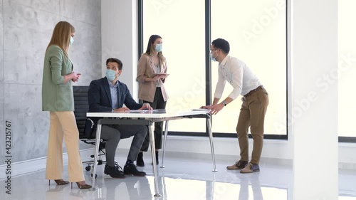 Wallpaper Mural Business people wearing masks and social distancing in office Torontodigital.ca