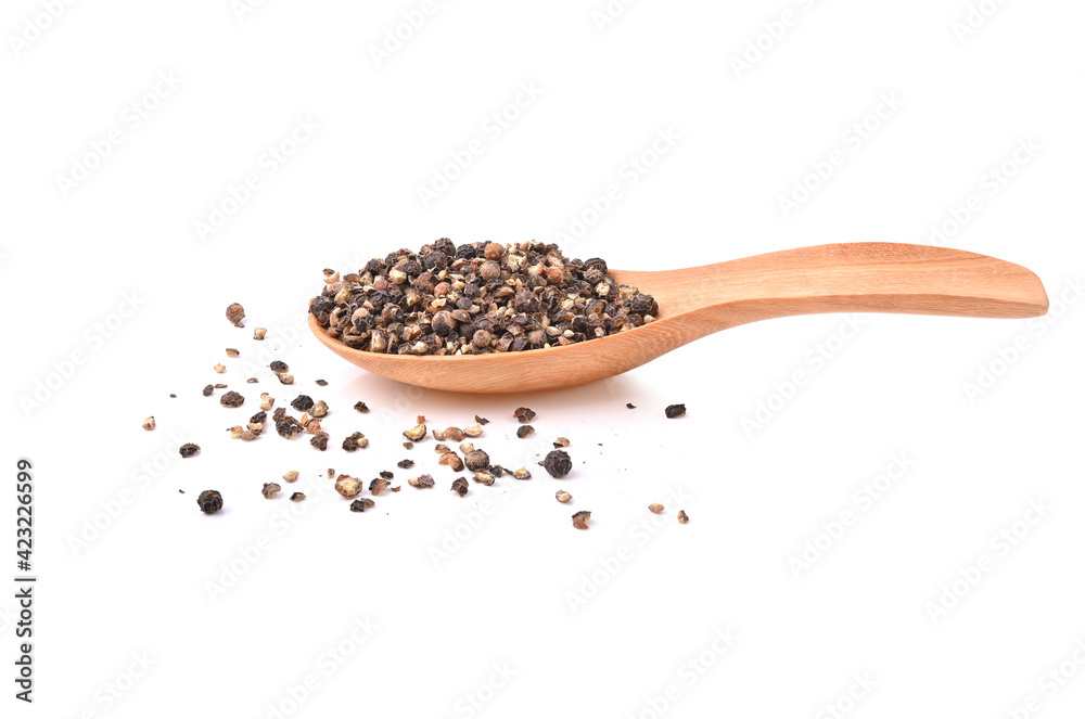 Ground black pepper isolated on a white background . Ground black pepper isolated on a white background .