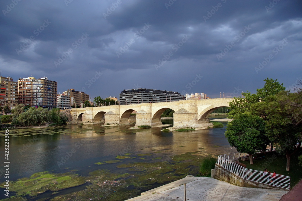 Naklejka premium a view of the ancient Stone Bridge, or Puente de Piedra in Spanish, over the Ebro River in Zaragoza, Spain