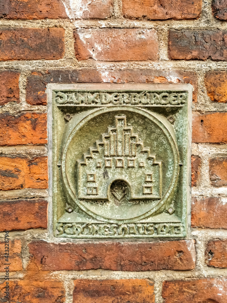 Flensburg Wappen, Nordertor as sculpture incrusted into wall of facade of a building
