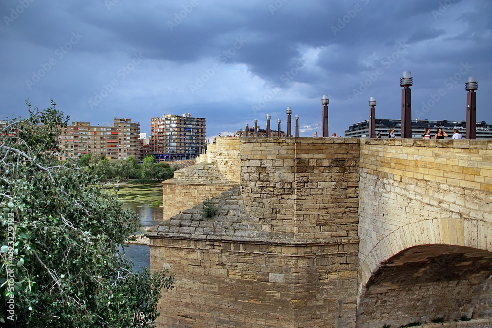 a view of the ancient Stone Bridge, or Puente de Piedra in Spanish, over the Ebro River in Zaragoza, Spain