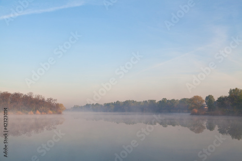 Morning fog over the calm river. The river Dnipro.