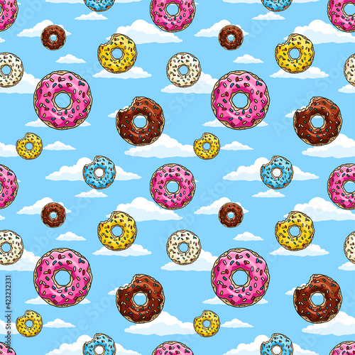 Cartoon donuts with pink, chocolate, mint, lemon glaze and colored sprinkles on blue background. Seamless pattern. Texture for fabric, wrapping, wallpaper. Decorative print.