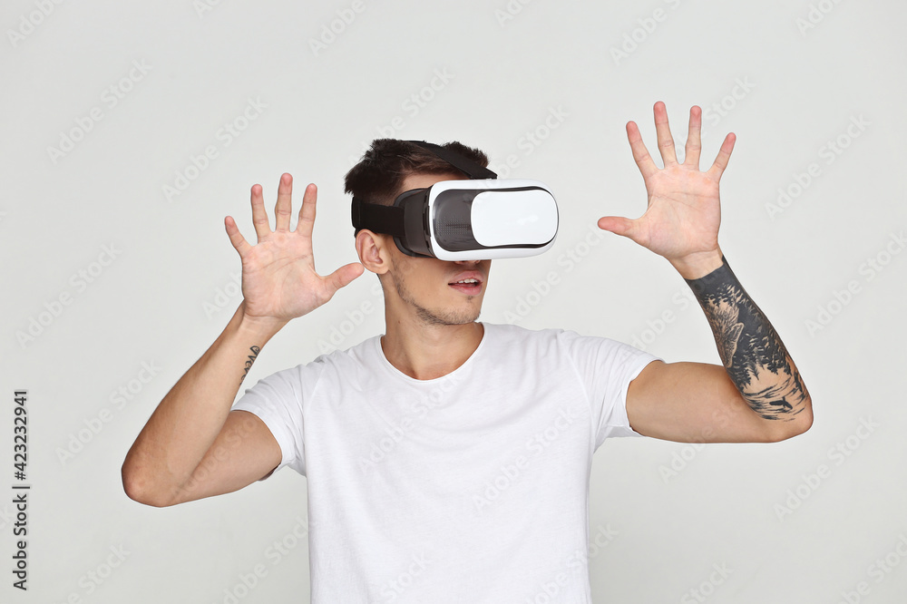 Man wearing virtual reality goggles. Studio shot Man wearing virtual reality goggles. Studio shot