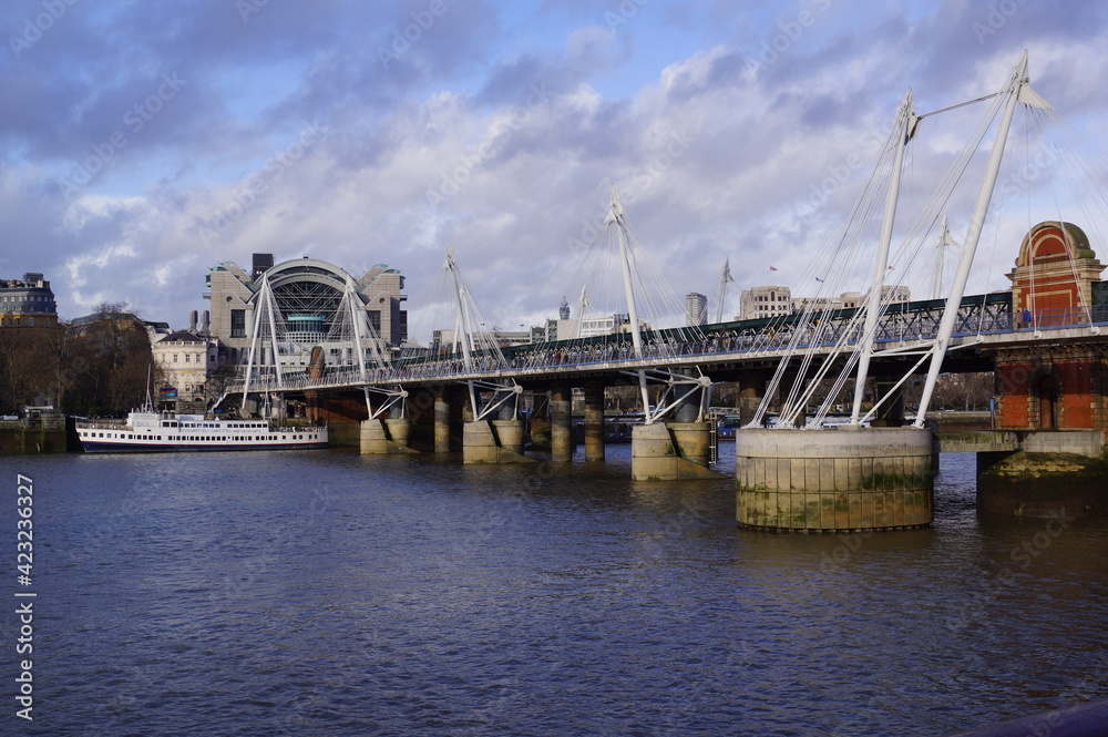 London, UK: view of the Golden Jubilee Bridges, with Charing Cross Station on the background