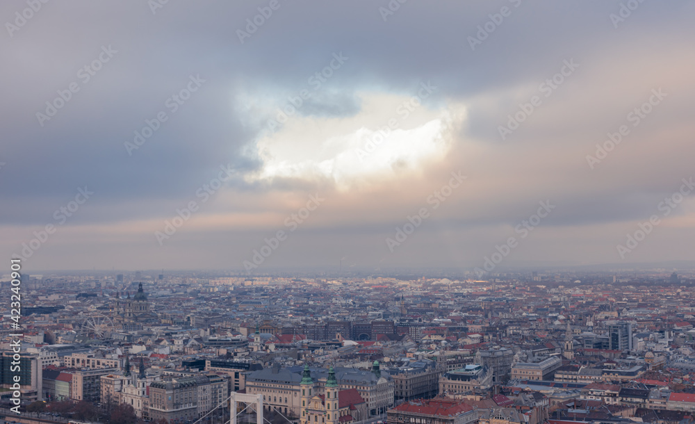 Hole in the clouds above Budapest. Cloudy winter day.