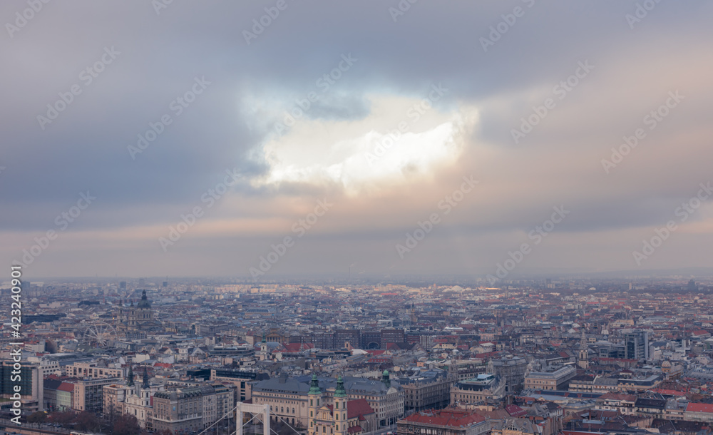 Hole in the clouds above Budapest. Cloudy winter day. Hole in the clouds above Budapest. Cloudy winter day.