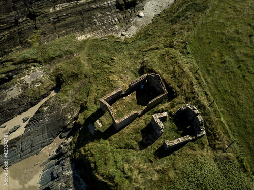 All that`s left... Old house ruins from above at Howe Strand, County Cork, Ireland. photo