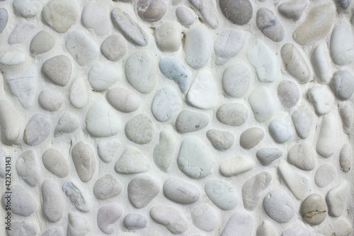 White small stones texture background, cladding tiled bathroom walls.
