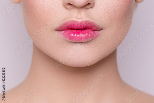 Delicate pink lips close-up. Natural nude lips close-up. Botex. Beautiful natural lips. Fashion. Facial skin care. Lip care. Natural cosmetic. Hyaluronic acid in the lips.