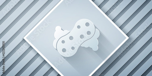 Paper cut Sponge with bubbles icon isolated on grey background. Wisp of bast for washing dishes. Cleaning service logo. Paper art style. Vector