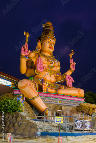 Giant statue of Shiva close-up in late evening, Trincomalee photo