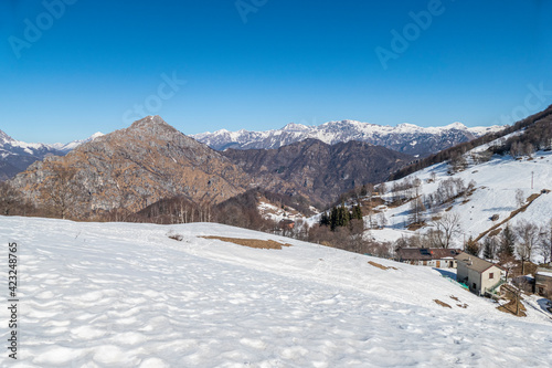 Wide view of the Mount Grigna with snow and blue sky © Alessio