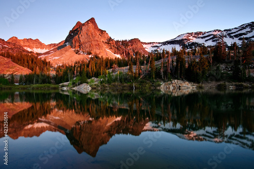 Warm sunset light on the Sundial as it reflects in Lake Blanche, Big Cottonwood Canyon of the Wasatch mountains of northern Utah.  