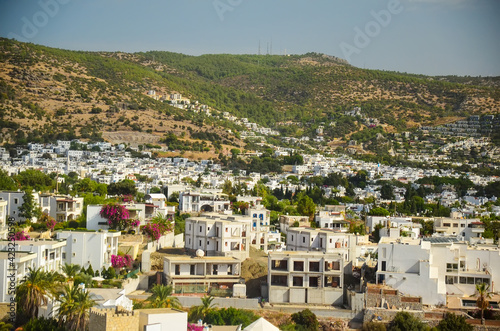 Panoramic View of Bodrum downtown, traditional white houses marina. Landscape of Traditional Bodrum Aegean architecture style . Vacation in Turkey