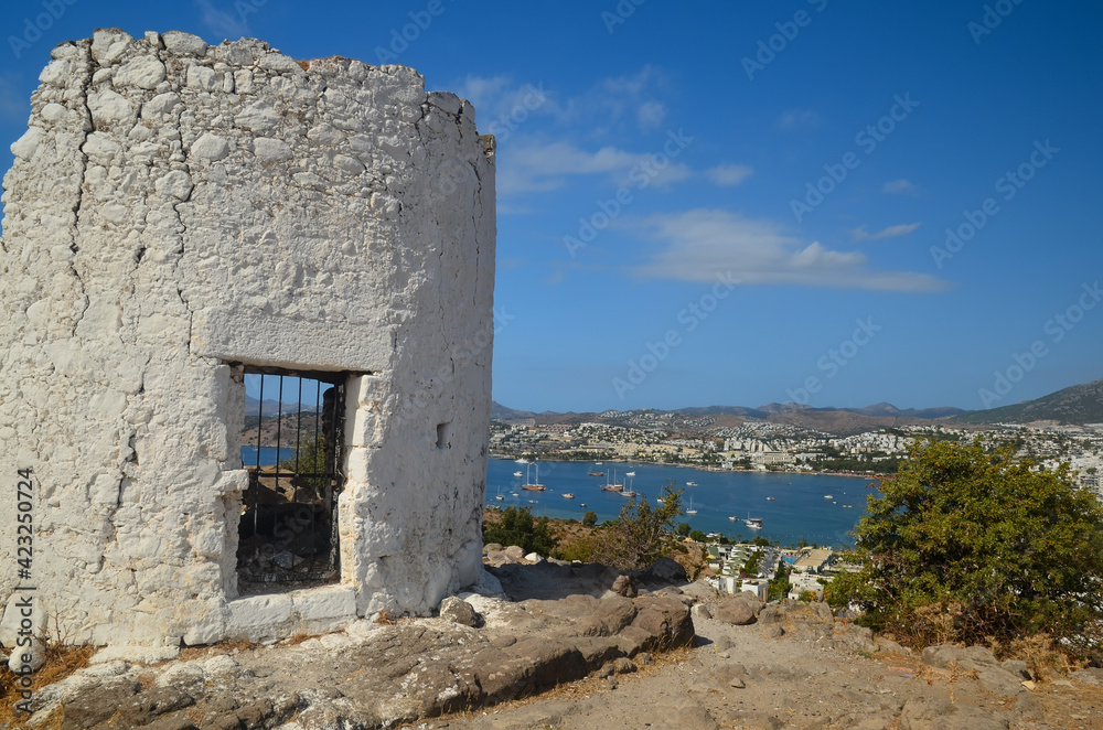  Historical Windmill of Bardakci Cove.  Ruins of white windmill located on the hill top between Gumbet and Bodrum bay. Bodrum landmark, Turkey