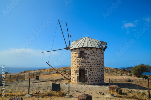 Historical Windmill of Bardakci Cove.  Ruins of white windmill located on the hill top between Gumbet and Bodrum bay. Bodrum, Turkey
