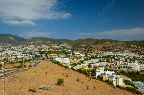 Panoramic View of Bodrum downtown, traditional white houses marina.  Landscape of Traditional Bodrum Aegean architecture style . Vacation in Turkey