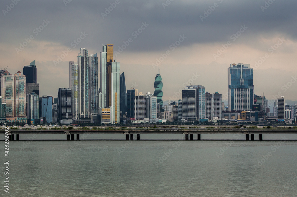 Naklejka premium Construction boom in Panama City. Skyline of Panama City on a cloudy day with modern buildings. View from Cinta Costera