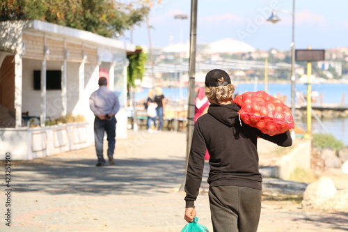 Tableau sur toile the man who takes a sack of onions and goes home. selective focus