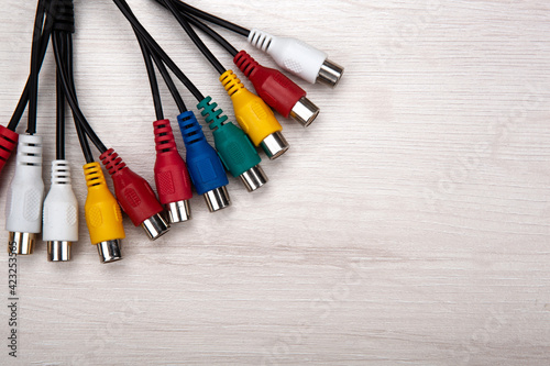 colored audio wires tulips on wooden background