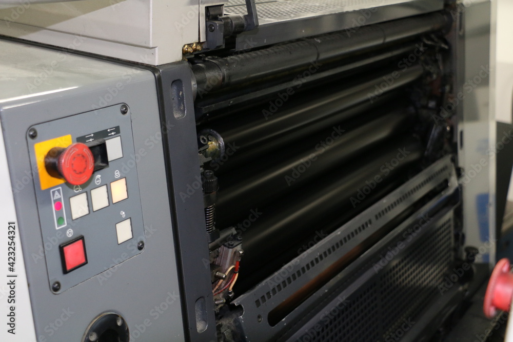 Black painted roller system of the printing machine in Matbaa. Komori lithrone. selective focus Black painted roller system of the printing machine in Matbaa. Komori lithrone. selective focus