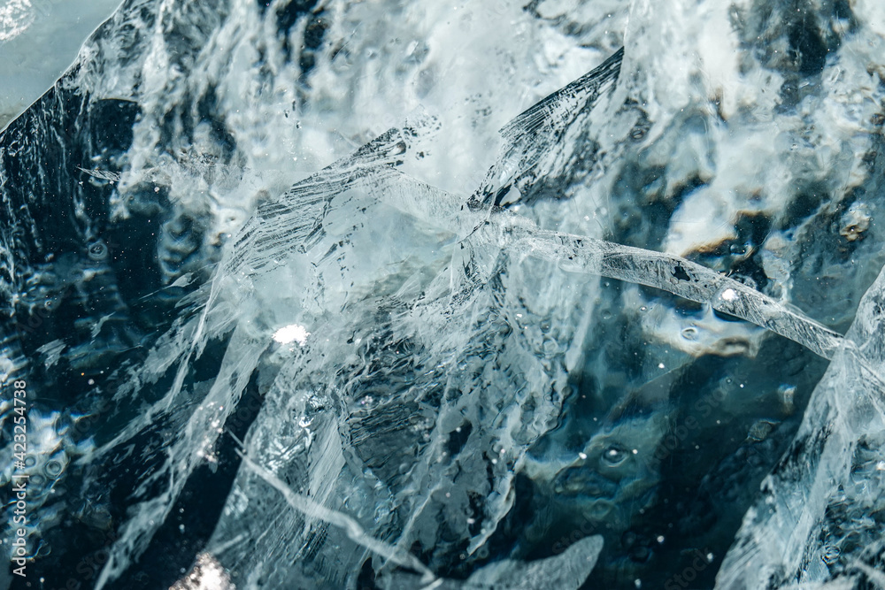 Cracked Ice of Frozen Baikal Lake in Winter. Top Down View Cracked Ice of Frozen Baikal Lake in Winter. Top Down View