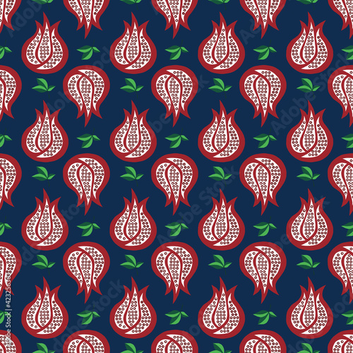 Seamless pattern pomegranate and leaves on blue