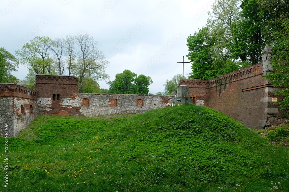 Ruins of palace and insurgent mound with a cross in Pilica, Krakow-czestochowa Upland, Silesia, Poland Ruins of palace and insurgent mound with a cross in Pilica, Krakow-czestochowa Upland, Silesia, Poland
