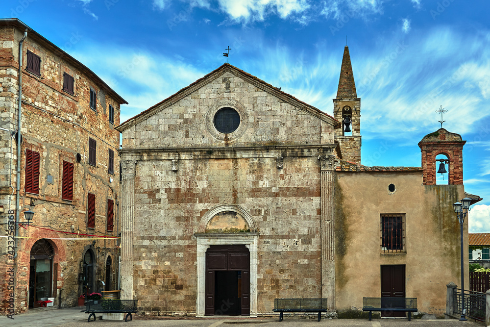 Stone, medieval church with a bell tower in the village of Magliano in Toscana