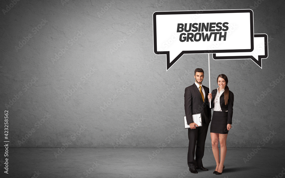 business person in casual holding road sign business person in casual holding road sign