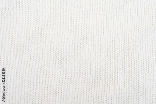 White knitted texture. White knitting background.