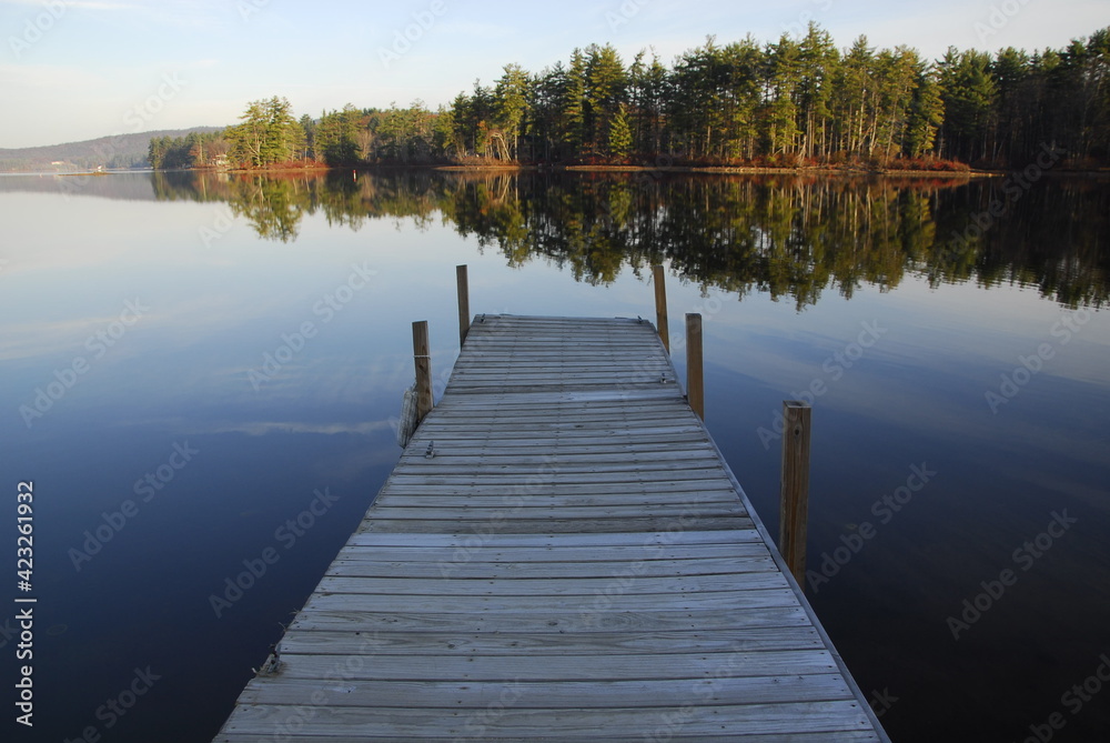 Enjoying the view of the morning reflections from the dock, Bow Lake, Strafford, New Hampshire Enjoying the view of the morning reflections from the dock, Bow Lake, Strafford, New Hampshire