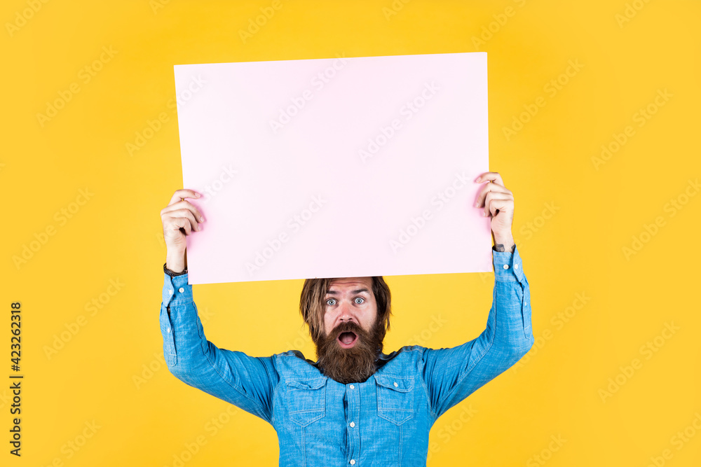 Your advertising here. brutal caucasian hipster with moustache. male barber facial care. confident and handsome. announcement and advertisement. surprised mature man. guy with beard hold banner Your advertising here. brutal caucasian hipster with moustache. male barber facial care. confident and handsome. announcement and advertisement. surprised mature man. guy with beard hold banner
