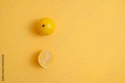 cut lemon on a yellow background. slice of fresh fruit. vitamins, diet food
