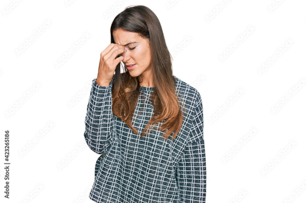 Young beautiful woman wearing casual clothes tired rubbing nose and eyes feeling fatigue and headache. stress and frustration concept. Young beautiful woman wearing casual clothes tired rubbing nose and eyes feeling fatigue and headache. stress and frustration concept.