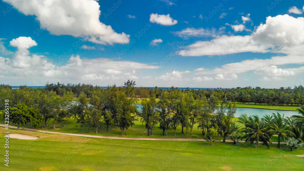 Golf course along a beautiful island coastline, drone point of view