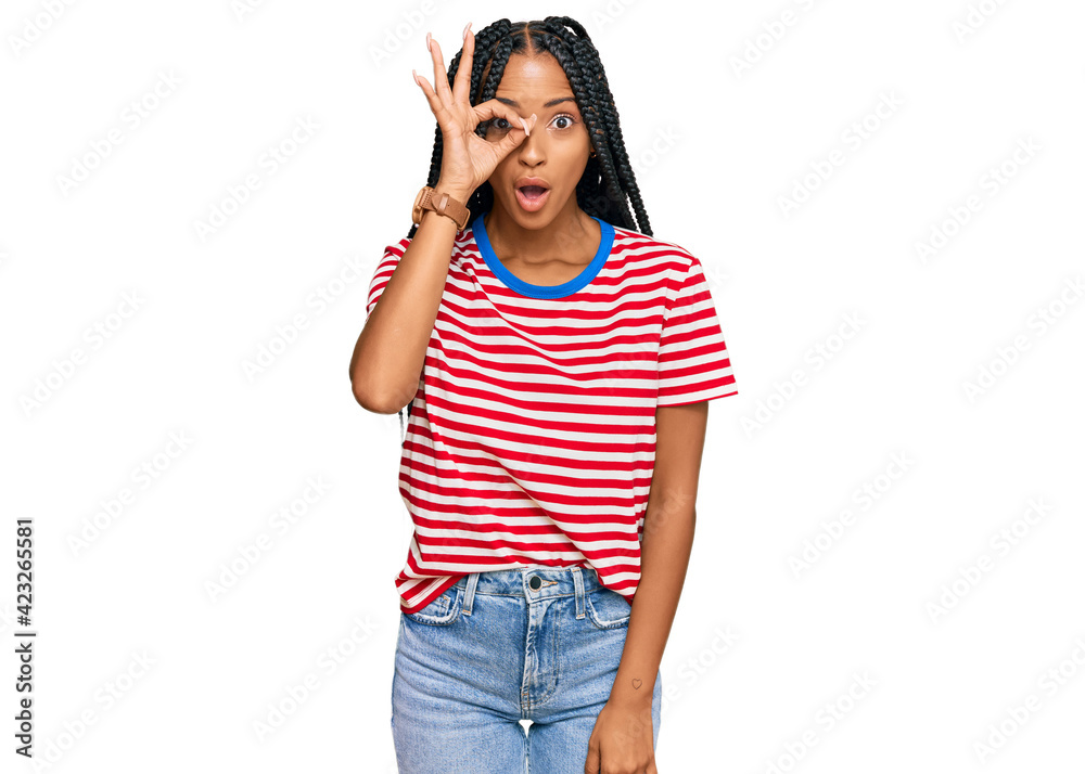 Beautiful hispanic woman wearing casual clothes doing ok gesture shocked with surprised face, eye looking through fingers. unbelieving expression. Beautiful hispanic woman wearing casual clothes doing ok gesture shocked with surprised face, eye looking through fingers. unbelieving expression.