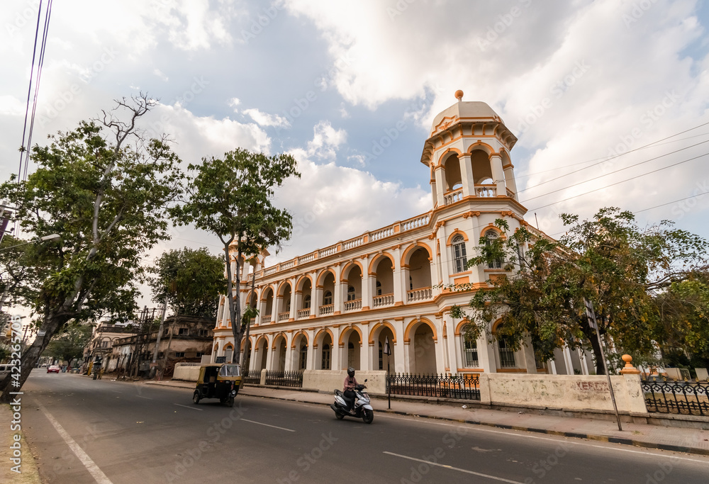 An old colonial era building with vintage architecture in the city of Mysuru.