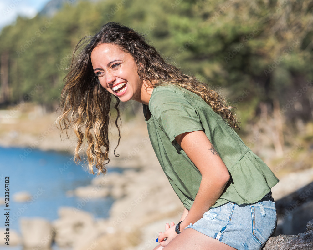 Pretty girl with curly hair in summer. Pretty girl with curly hair in summer.