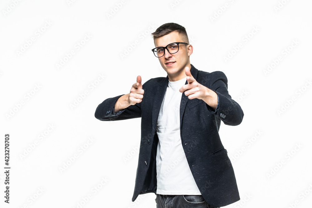 Young businessman pointing to the camera on white background
